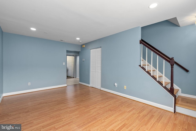 unfurnished living room featuring light wood-type flooring