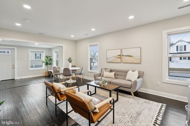 living room featuring dark hardwood / wood-style flooring