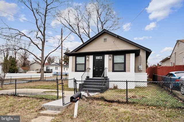 bungalow-style home featuring a front yard