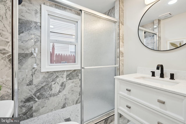 bathroom with vanity and walk in shower