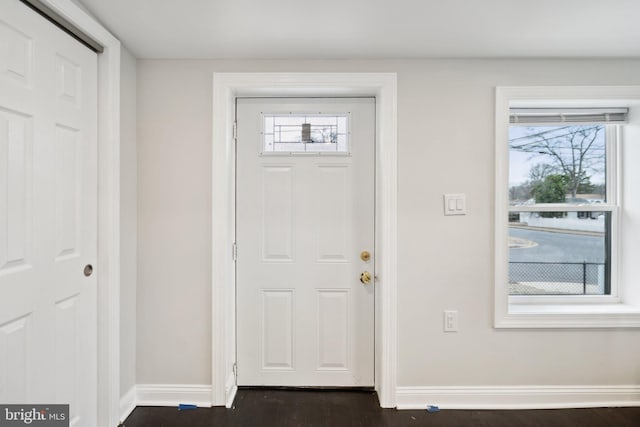 foyer with dark hardwood / wood-style flooring