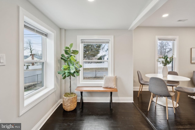 dining space featuring dark hardwood / wood-style floors