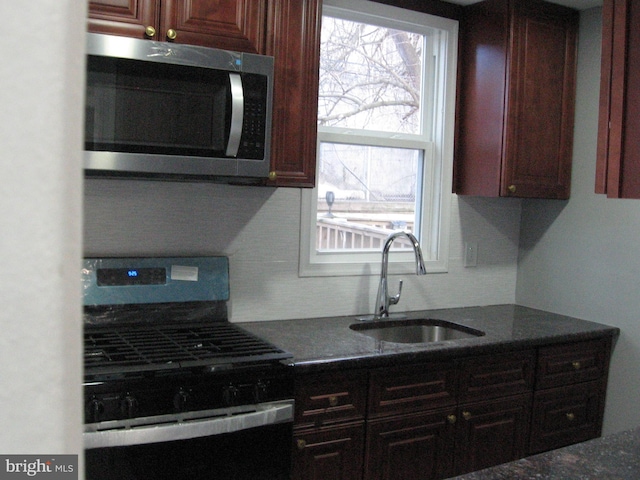 kitchen with sink and black range with gas cooktop