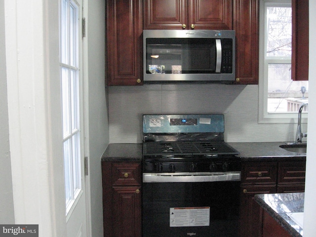 kitchen with sink and black / electric stove