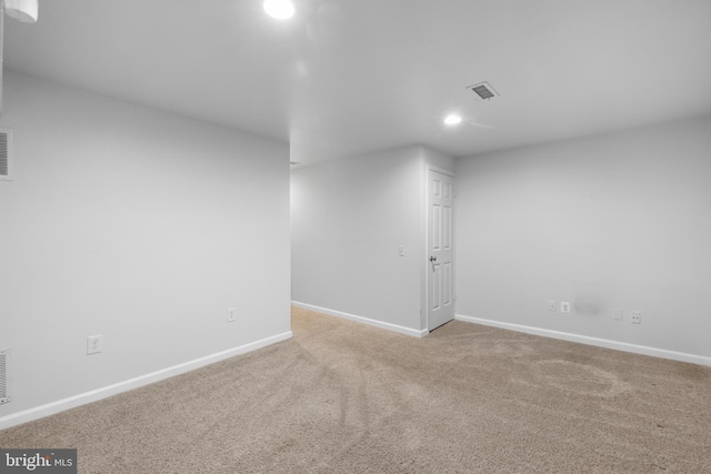 empty room featuring light carpet