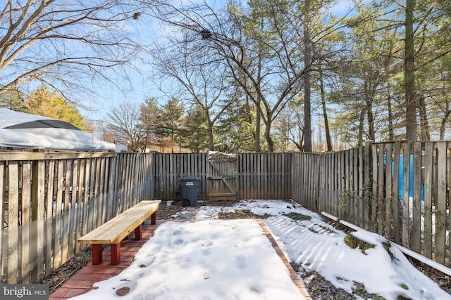 view of yard layered in snow