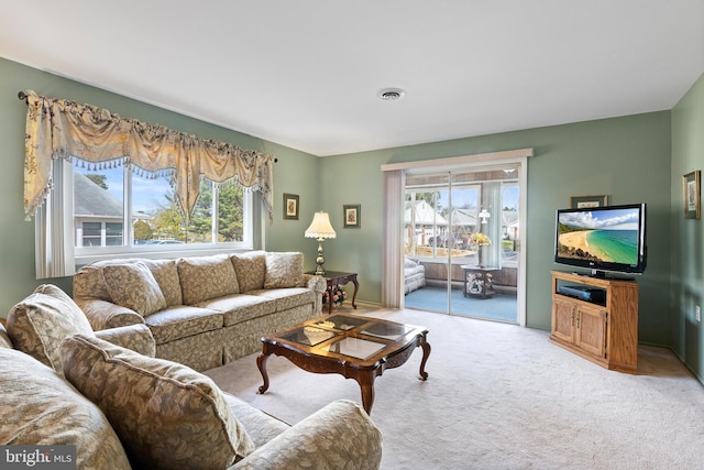 living room featuring light colored carpet