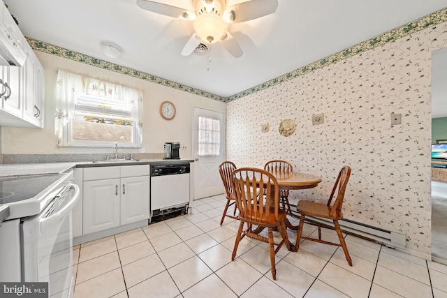 kitchen with white cabinetry, dishwasher, sink, light tile patterned flooring, and range