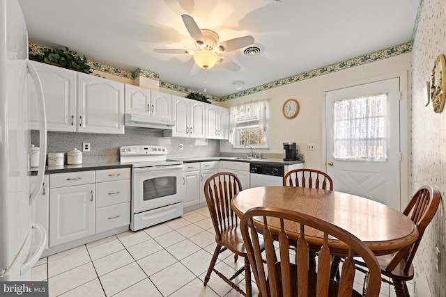 kitchen with white appliances, white cabinetry, ceiling fan, and light tile patterned flooring