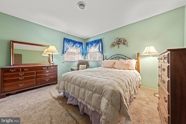 bedroom with light carpet