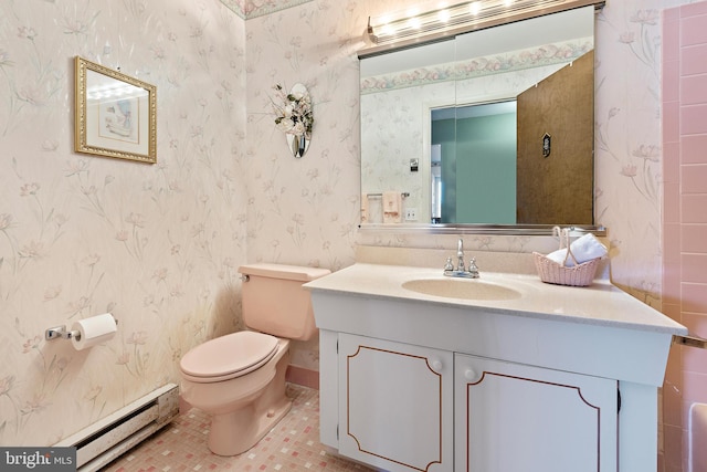 bathroom featuring tile patterned floors, toilet, vanity, and a baseboard heating unit