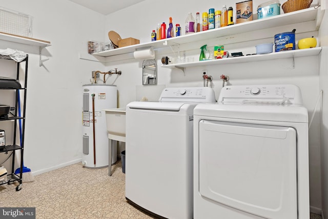 washroom with independent washer and dryer and water heater