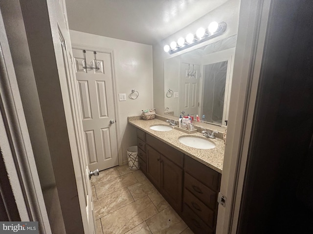 bathroom featuring tile patterned floors and vanity