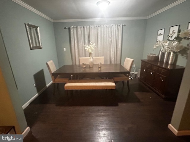 dining room with dark hardwood / wood-style flooring and crown molding