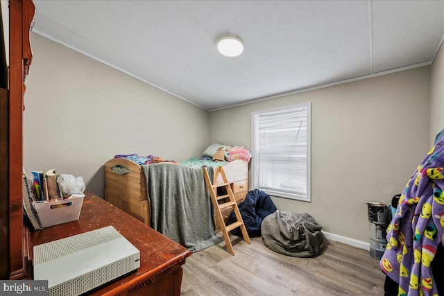 2612 Oakwood Ct, East Stroudsburg, PA 18302 - bedroom with a textured ceiling and light hardwood / wood-style flooring