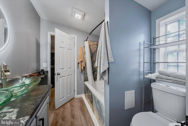2612 Oakwood Ct, East Stroudsburg, PA 18302 - full bathroom featuring shower / bath combo, wood-type flooring, a textured ceiling, toilet, and vanity