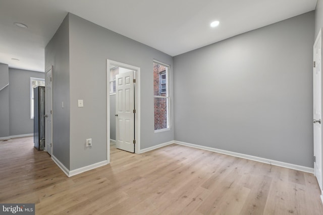 unfurnished room featuring light wood-type flooring