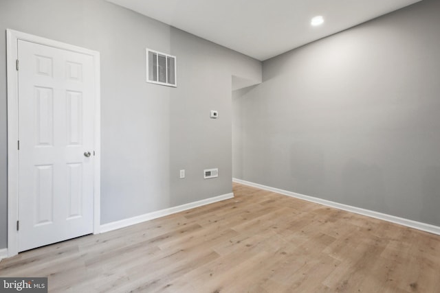 spare room with light hardwood / wood-style floors