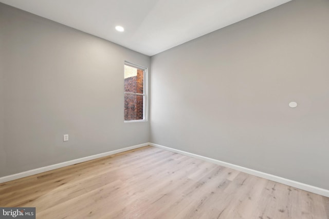 spare room with light wood-type flooring