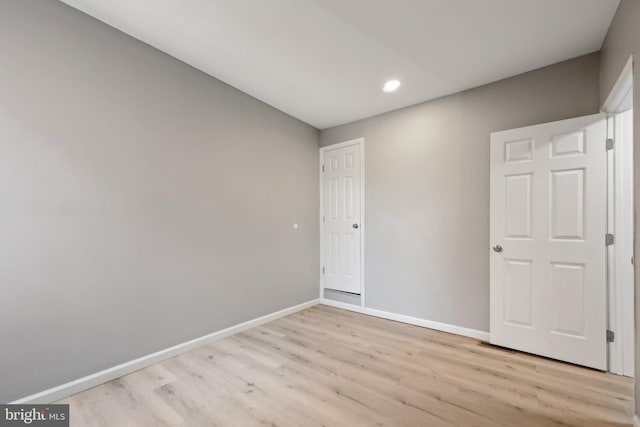 unfurnished bedroom with light hardwood / wood-style flooring