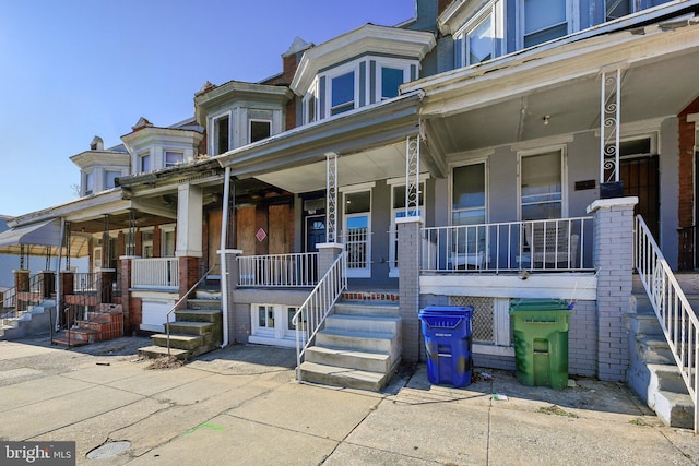 view of property featuring covered porch