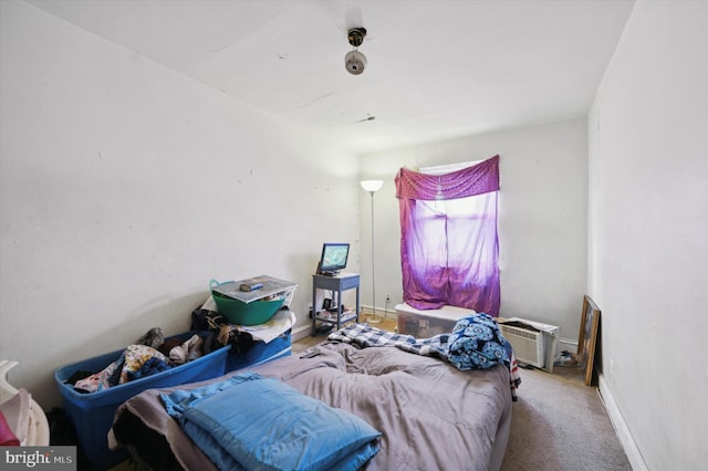 bedroom with a wall unit AC