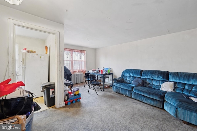 carpeted living room featuring radiator