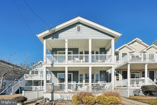 view of front of house featuring a balcony and covered porch