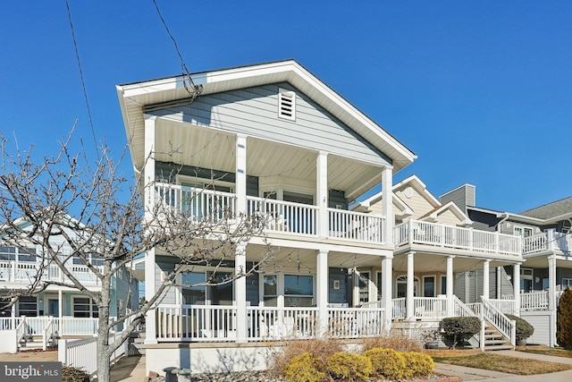 view of front of house featuring covered porch and a balcony