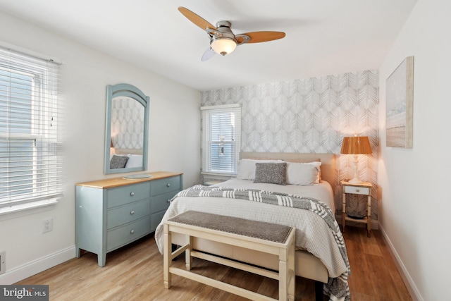 bedroom featuring light wood-type flooring and ceiling fan