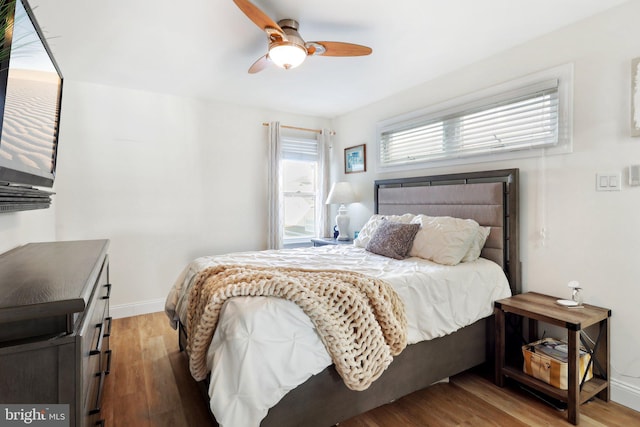 bedroom featuring light wood-type flooring and ceiling fan