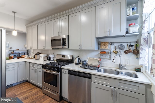 kitchen featuring gray cabinetry, sink, and stainless steel appliances