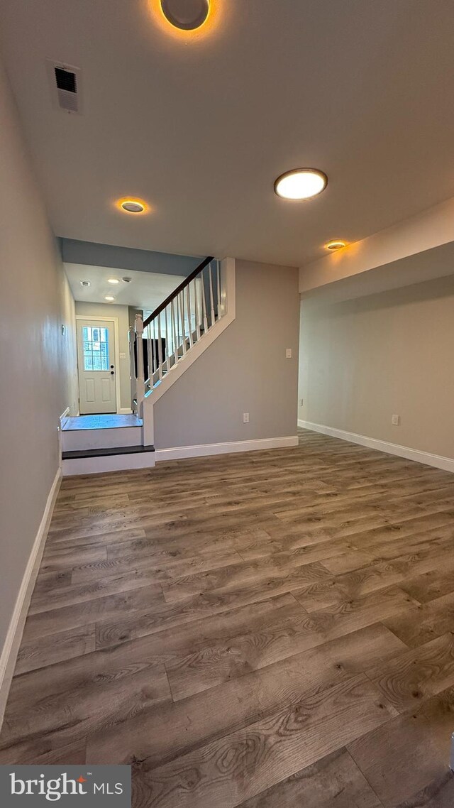 interior space with dark hardwood / wood-style floors