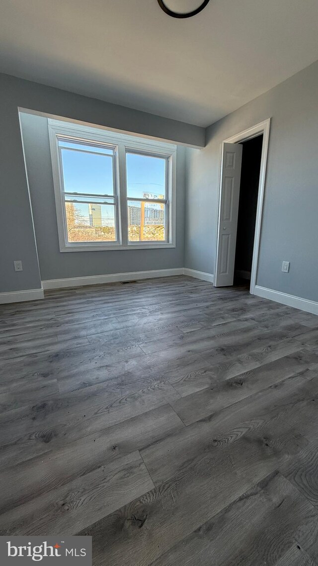 empty room featuring dark hardwood / wood-style floors