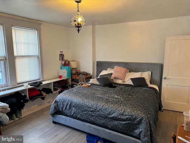 bedroom featuring wood-type flooring