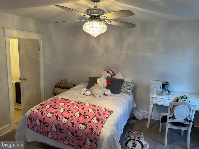 bedroom featuring ceiling fan and dark hardwood / wood-style floors