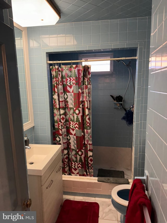 bathroom featuring toilet, vanity, and a shower with shower curtain