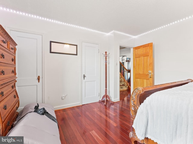 bedroom featuring dark wood-type flooring