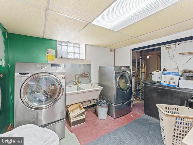 laundry room with independent washer and dryer and sink