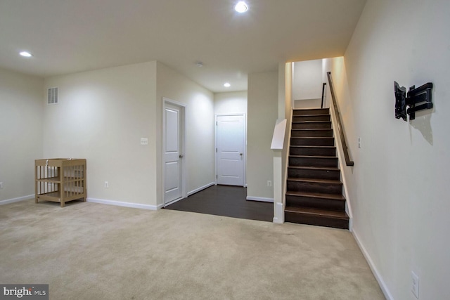 stairway with carpet floors