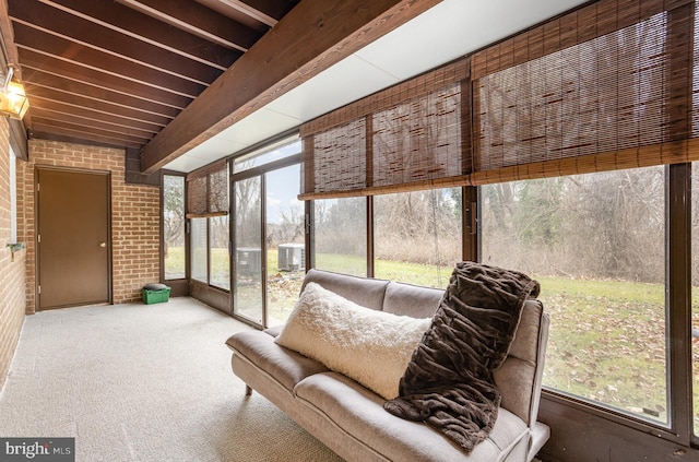 sunroom with beamed ceiling