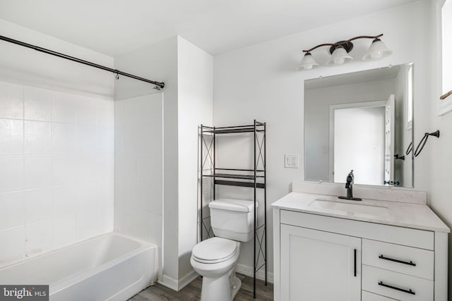 full bathroom with toilet, vanity, and tub / shower combination