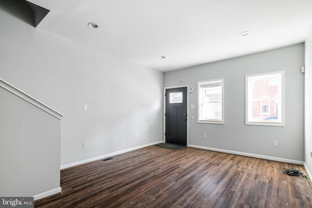 entrance foyer with dark hardwood / wood-style flooring