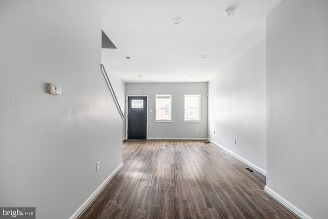 interior space with dark hardwood / wood-style flooring