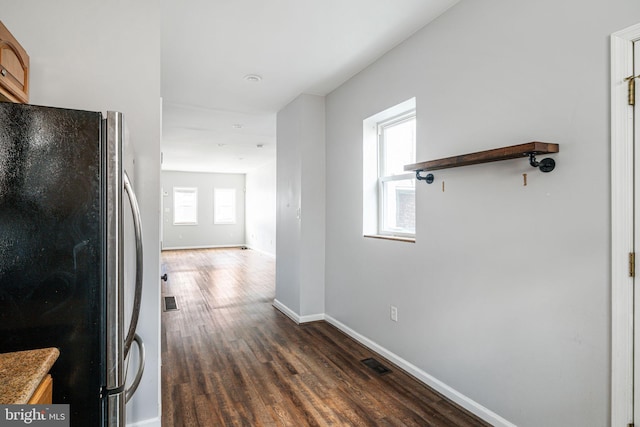 corridor featuring dark hardwood / wood-style floors