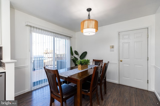 dining space with dark wood-type flooring