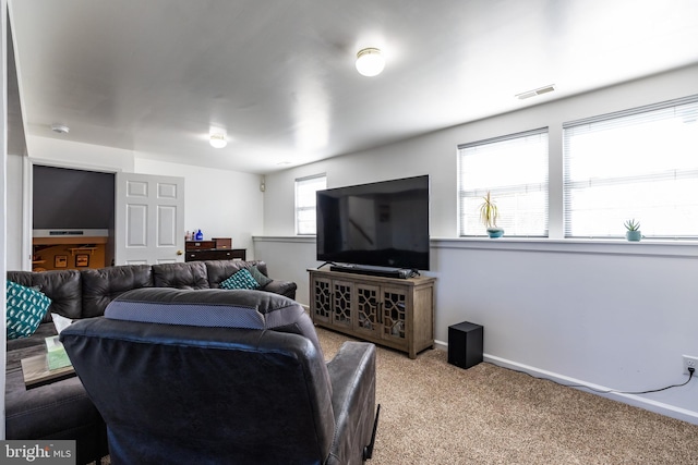 carpeted living room featuring a healthy amount of sunlight