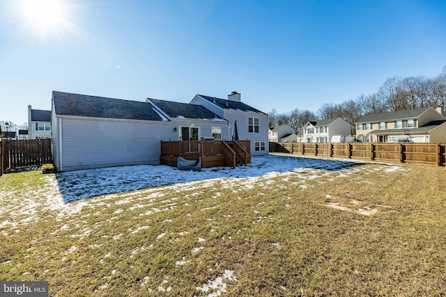 back of house with a yard and a wooden deck