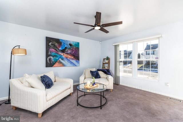 living room featuring ceiling fan and carpet floors