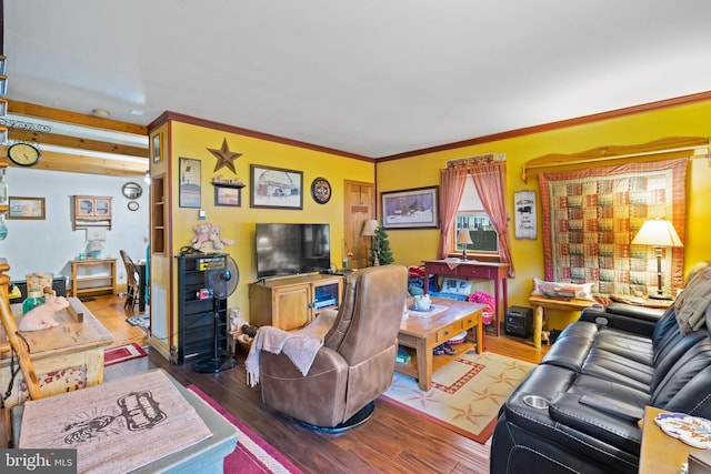 living room featuring ornamental molding and hardwood / wood-style flooring